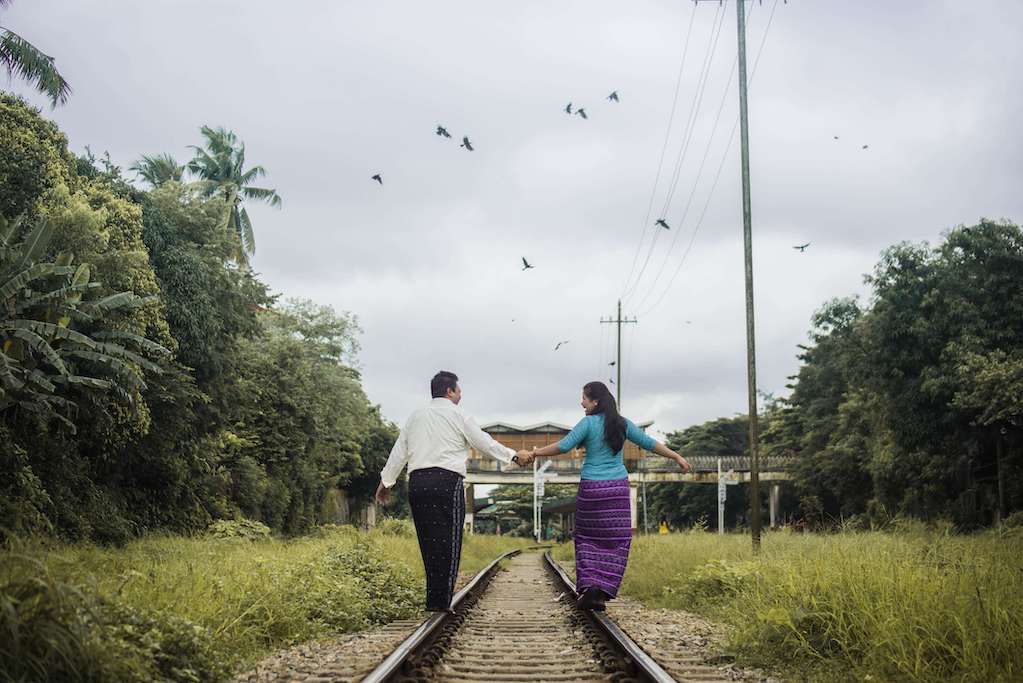 aphasia-recovery-photo-2 couple with back to camera walking along train tracks holding hands